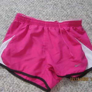 pink nike athletic running shorts